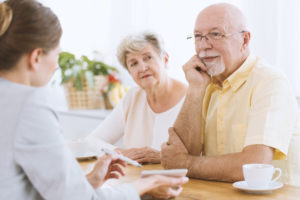 A couple of people sitting at a table