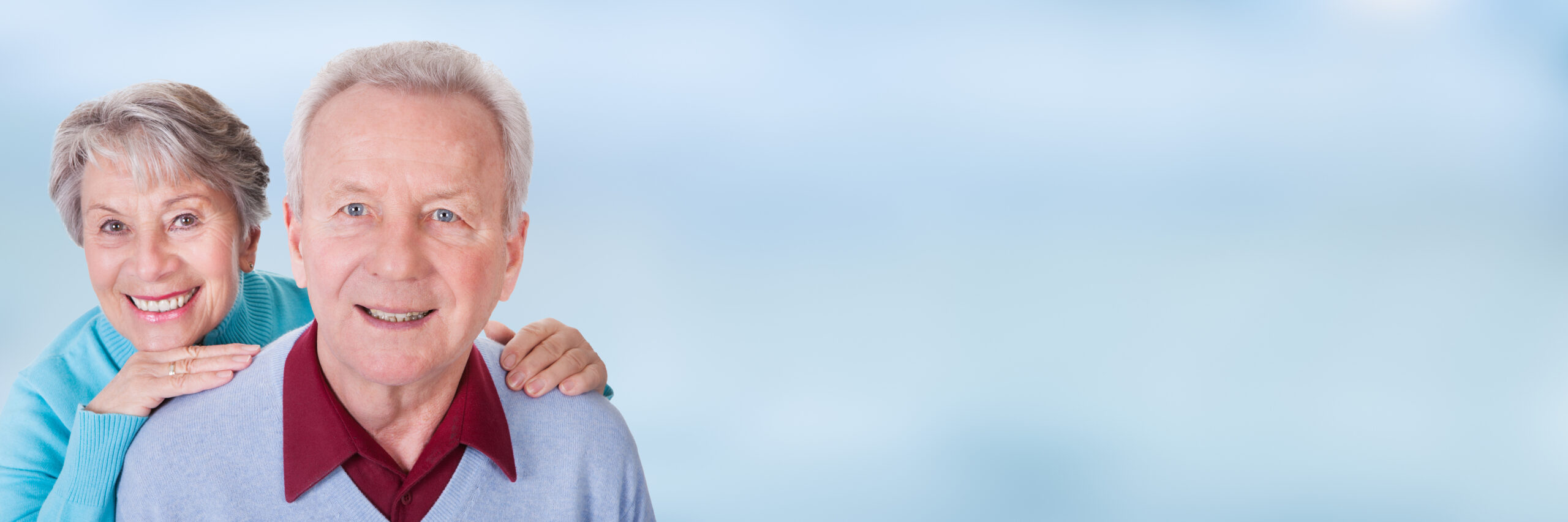 An older couple posing for a photo.