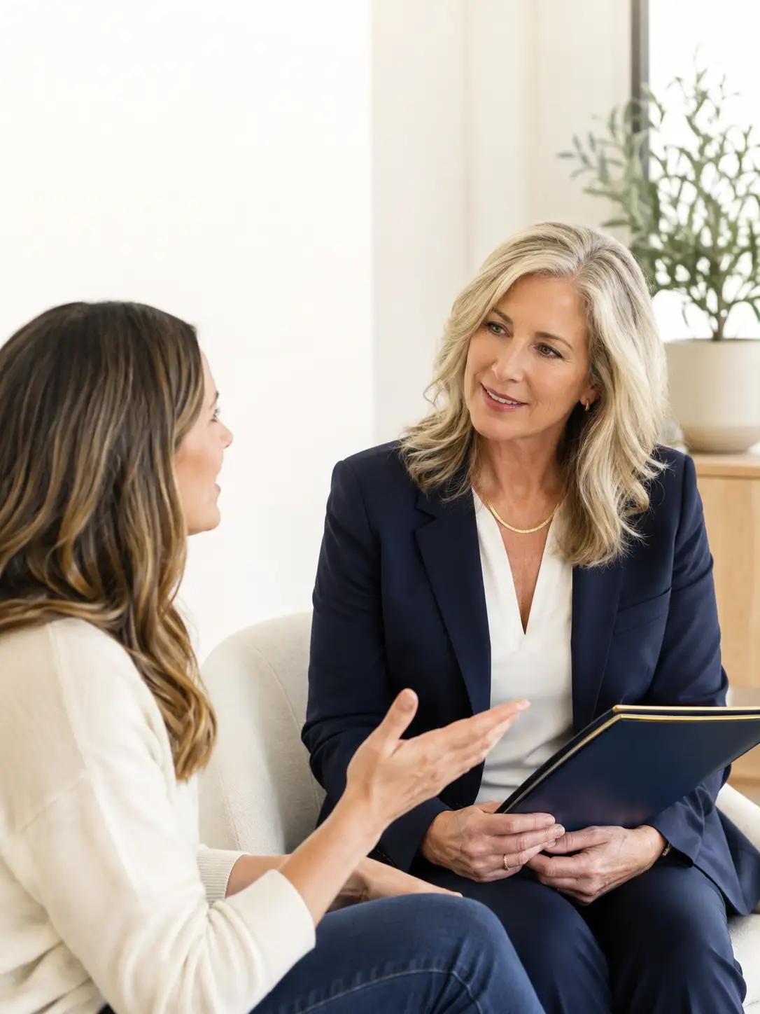 Therapist and client talking in comfortable office