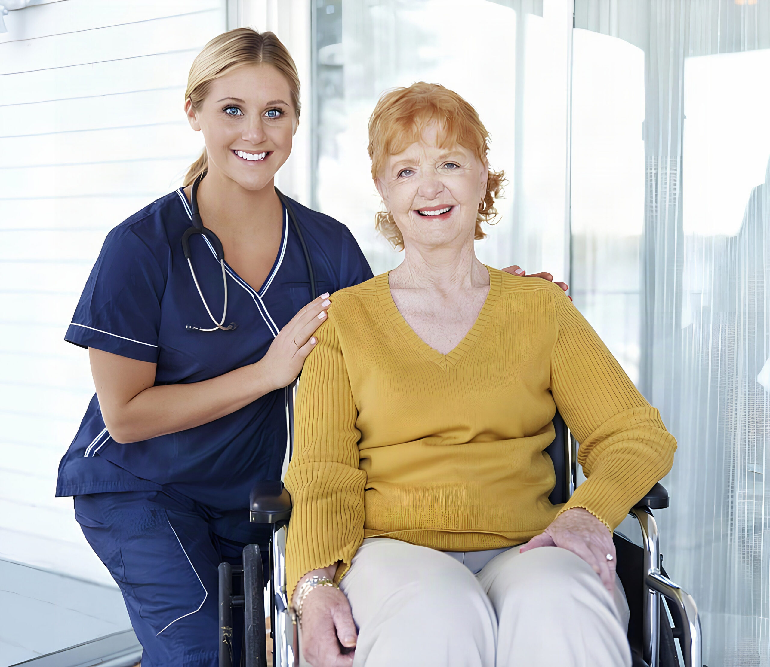 Smiling nurse with elderly woman in wheelchair