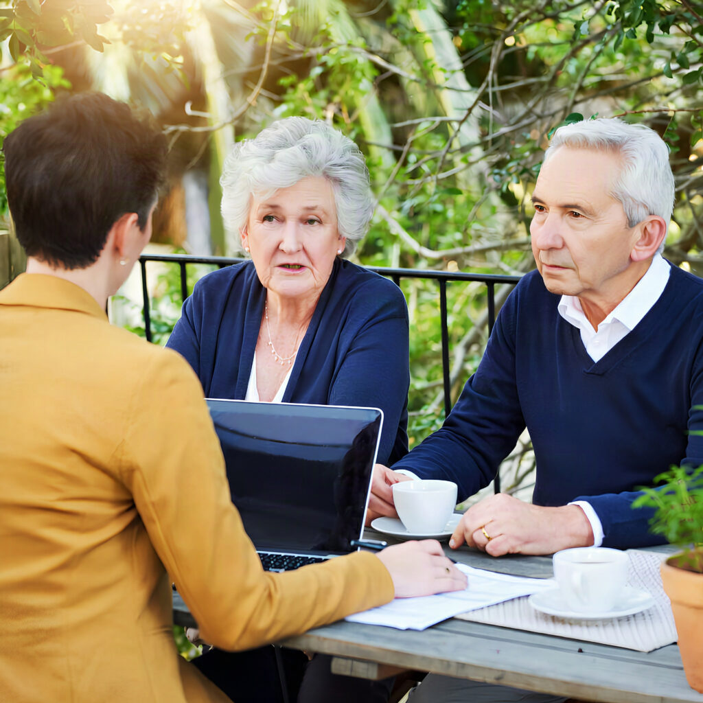 Senior couple meeting financial advisor outdoors